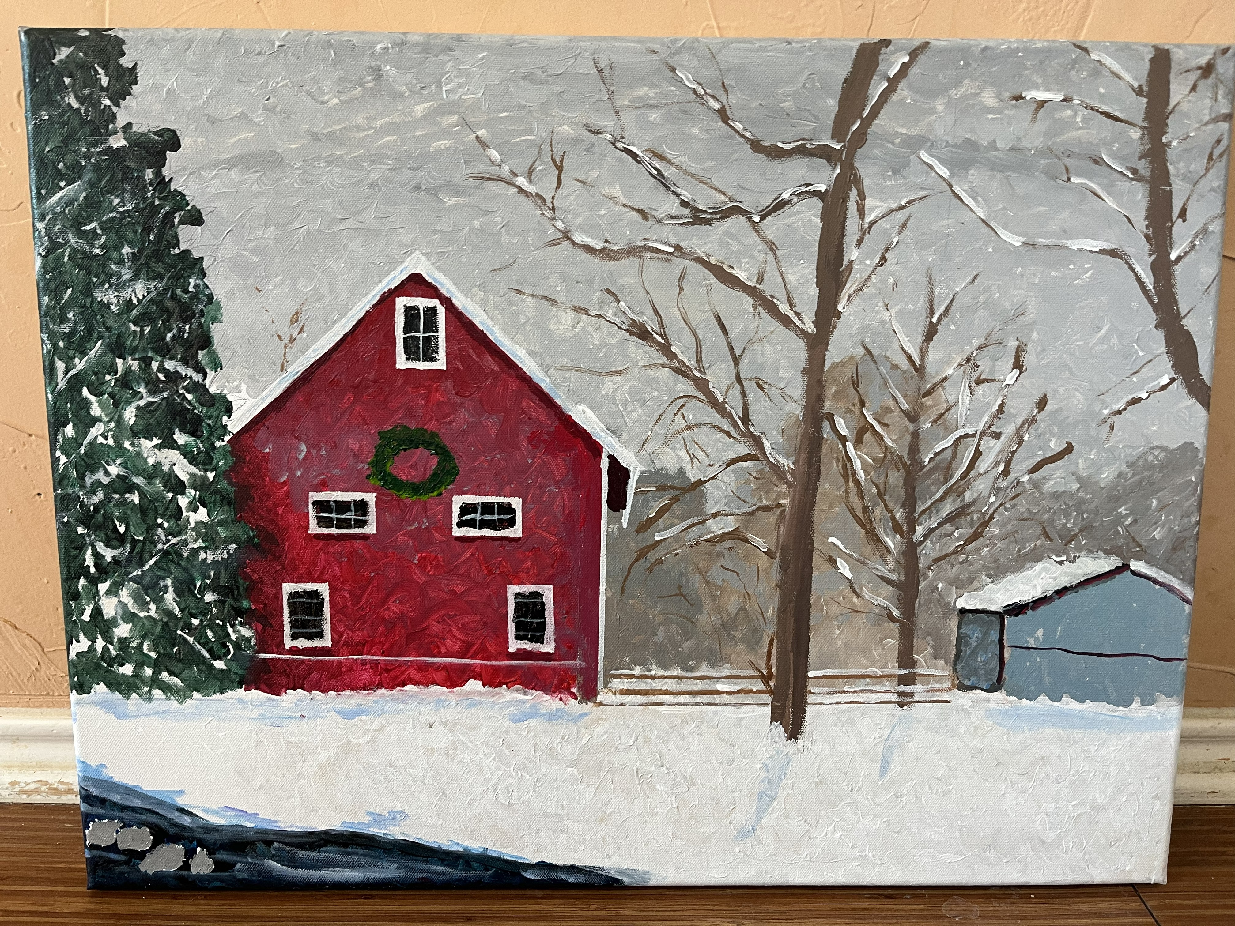 Two barns and some trees in wintertime